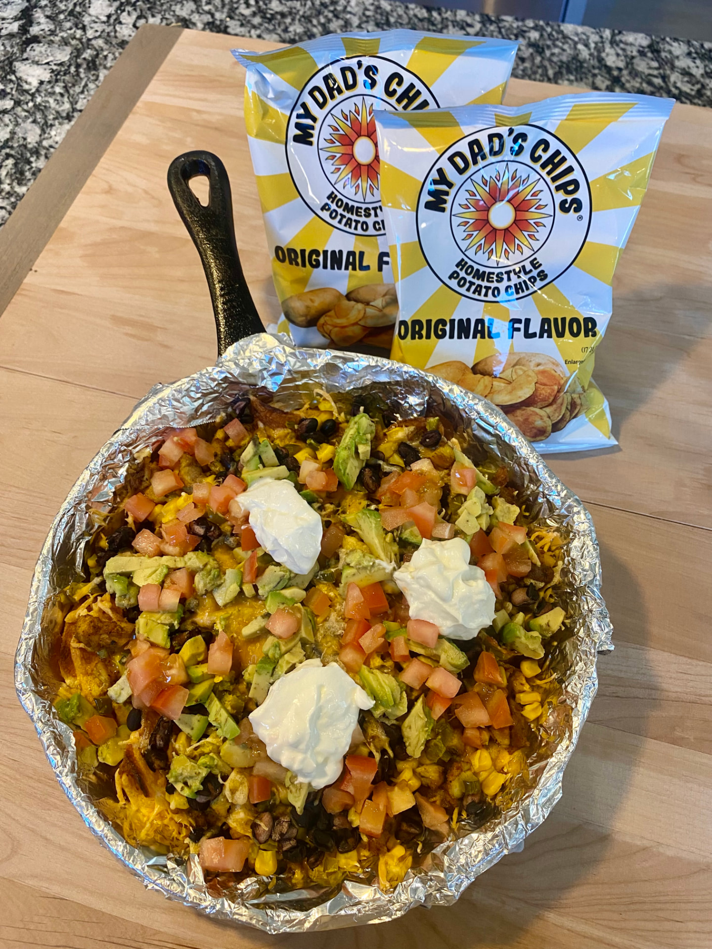 Sheet pan of loaded barbecue chicken nachos