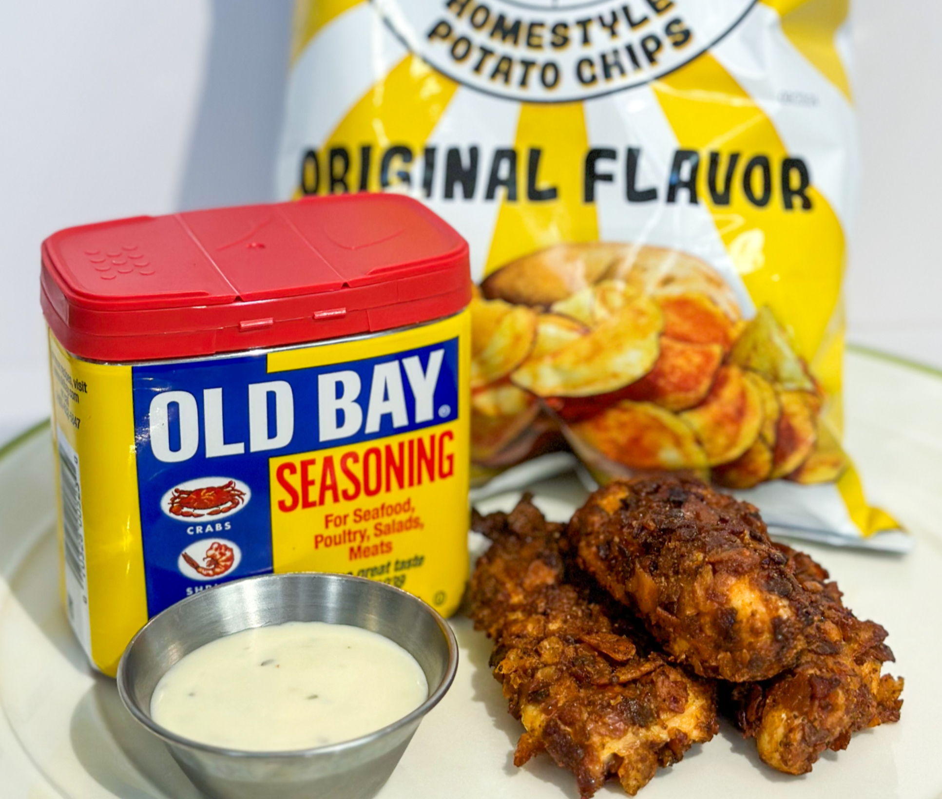Chip crusted chicken tenders on a wire rack