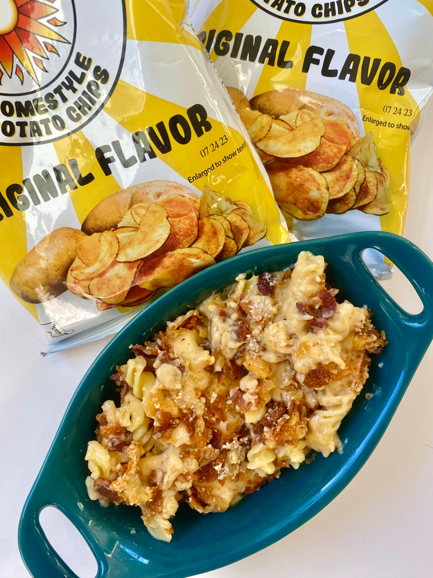 Baked mac and cheese with a golden crushed chip crust